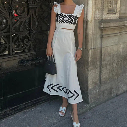 Dawn – High-Waisted Suspended Dress with Flutter Sleeves and Geometric Print